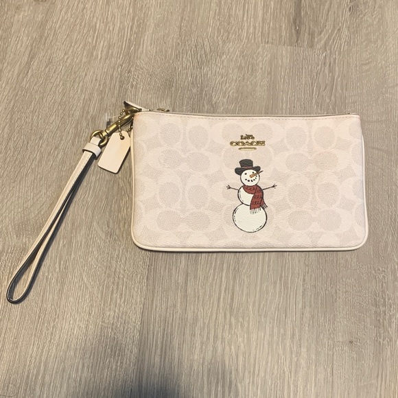 Coach Handbags - Coach Limited Edition NWOT Ivory/ Beige Corner Zip Wristlet with Snowman Motif